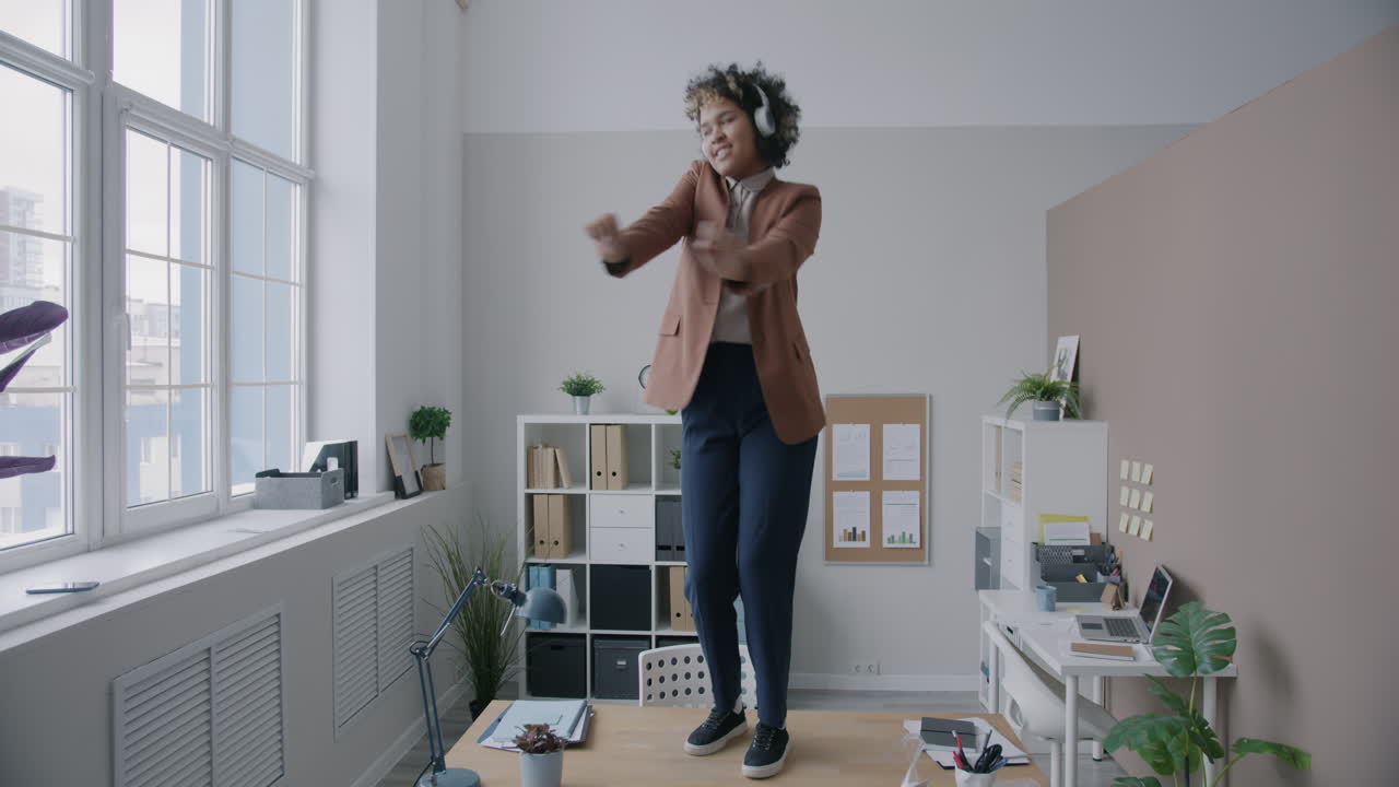 Woman Dancing on Office Desk