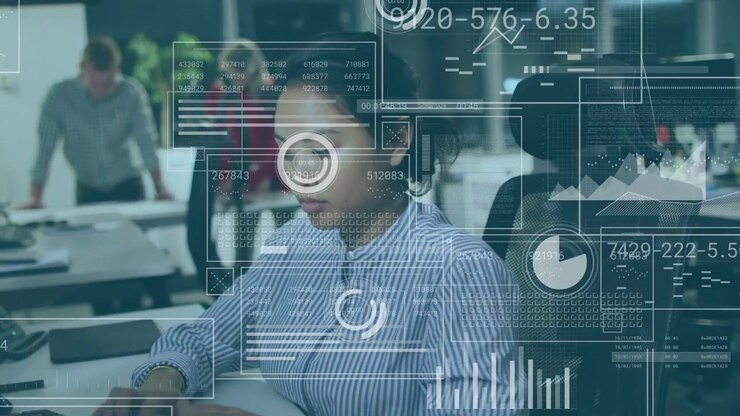 Woman typing on keyboard and scanning screen, causing tech HUD charts overlaying scene for analysis