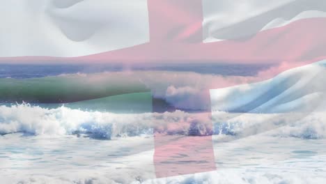 digital composition of waving england flag against waves in the sea
