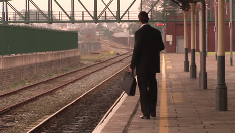 man waiting for train