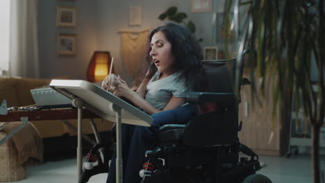 disabled woman painting in wheelchair