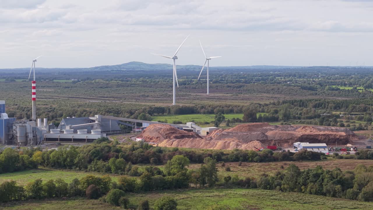 Edenderry Power Station Overlooking Cushaling Windfarm Near Edenderry, County Offaly, Ireland. Aerial Panning Shot