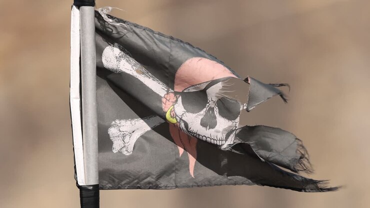 Jolly Roger flag flutters in a strong breeze