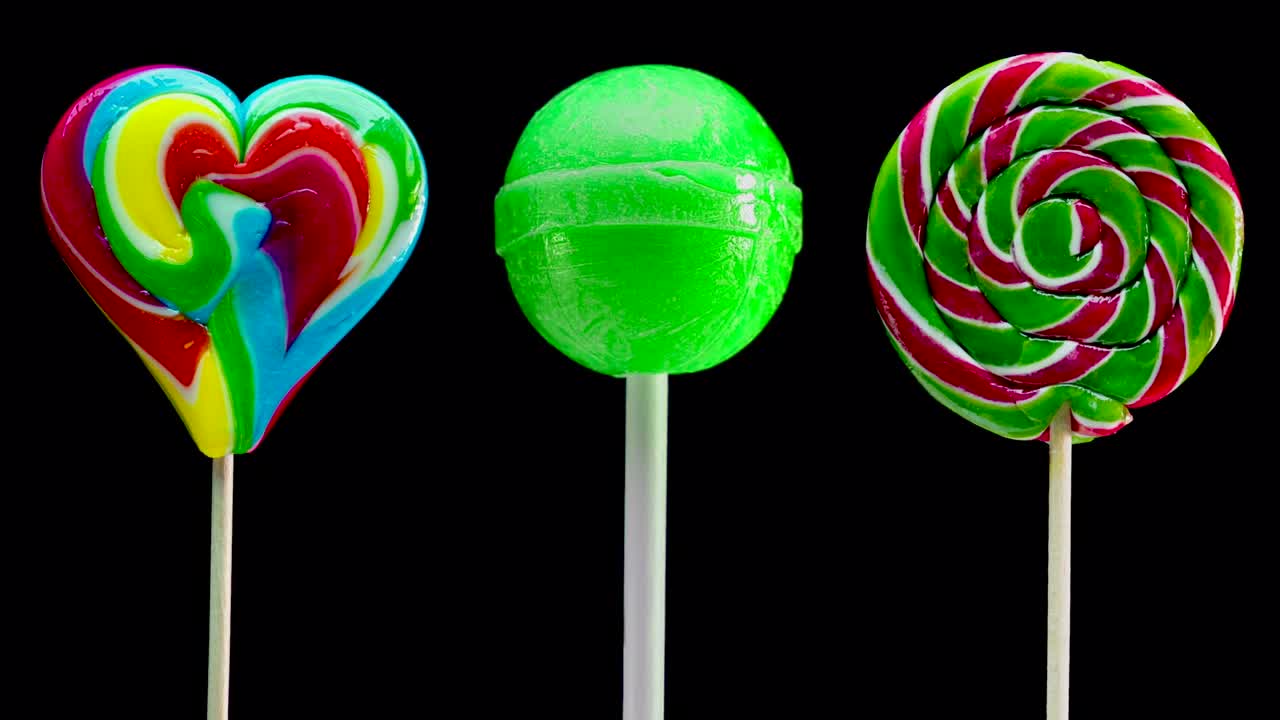 검은색 배경의 릴리팝의 스 모션 애니메이션 세트: 달한 사탕 나선형, 카라멜 사탕