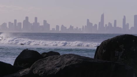 surfers at the currumbin beach in queensland, australia - static shot