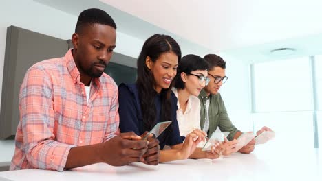 Business-colleagues-using-glass-digital-tablet-in-conference-room-4k