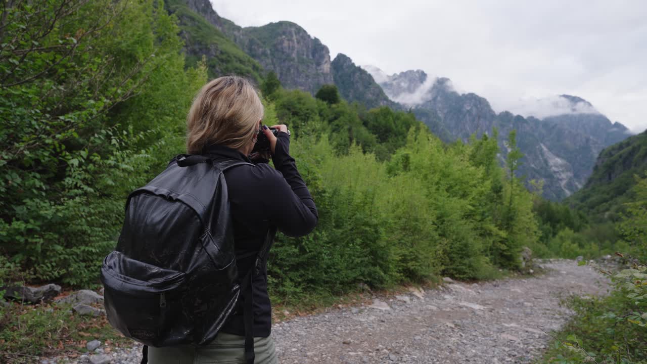Outdoor Woman Photographer Taking Pictures of Mountain Landscape Theth