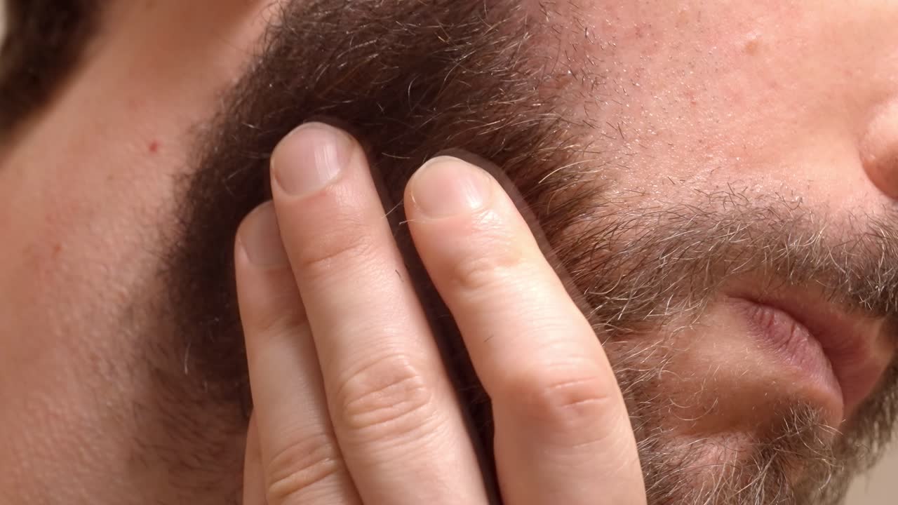 Face Shave: Razor Cutting Beard Stubble - Close Up View Detail