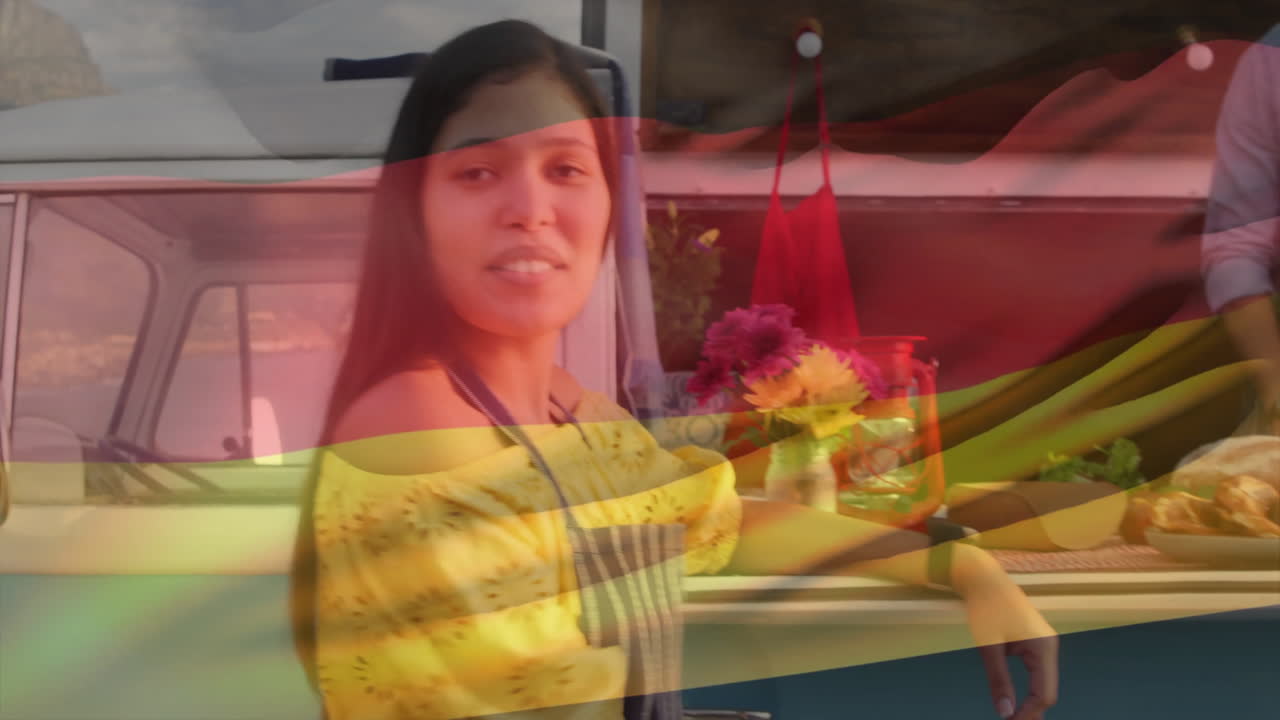 Wearing yellow dress with flowers, woman smiling with German flag animation overlay
