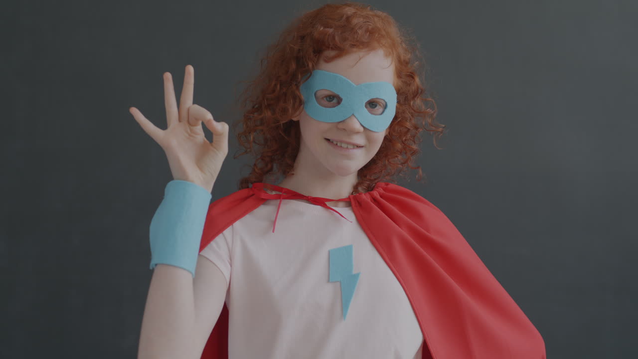 Superhero Girl Giving the Okay Sign