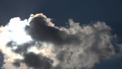 time lapse view at bright sunbeams with some lens flares and clouds in the sky.