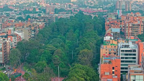 aerial flyover of the virrey park with brick residential buildings in the affluent neighborhood of el chico in bogota, colombia.