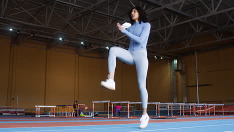 Woman-warming-up-indoors