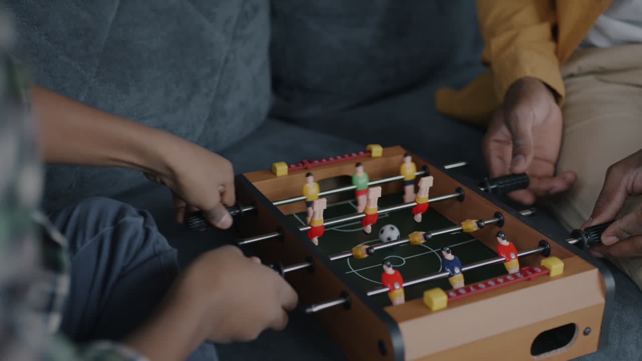 Family Playing Table Football
