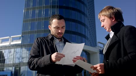 businessman tear blank paper on meeting outdoor