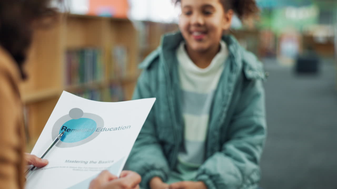 Child high fiving in library