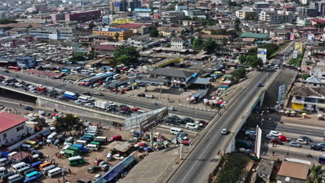 drone shot of moving traffic on a highway in accra
