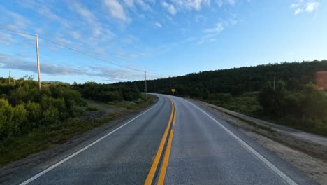 vehicle point-of-view driving a car on a road in norway