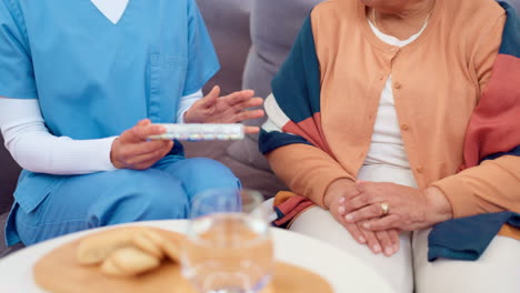 nurse giving medication to elderly patient