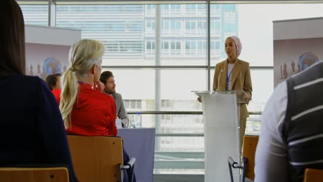 female speaker speaking in a business seminar 4k