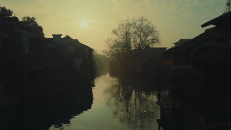 serene view of wuzhen, china with traditional architecture along a peaceful canal