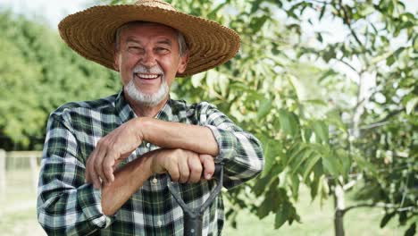 handheld video portrait of happy farmer in a straw hat