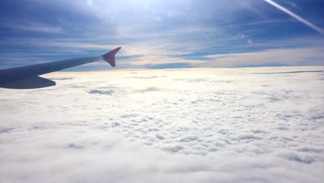 aircraft wing and cloud with sunrise in morning, airplane window view, 4k