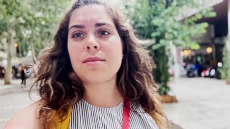 candid selfie of a woman vlogging her athens street walk