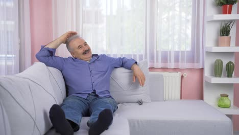 Happy-old-man-lying-on-the-sofa.-He-is-resting.