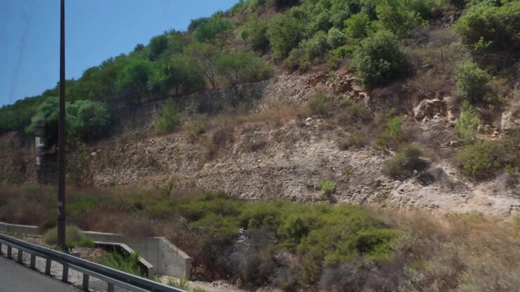 Driving along the hills of jerusalem in israel on a sunny day