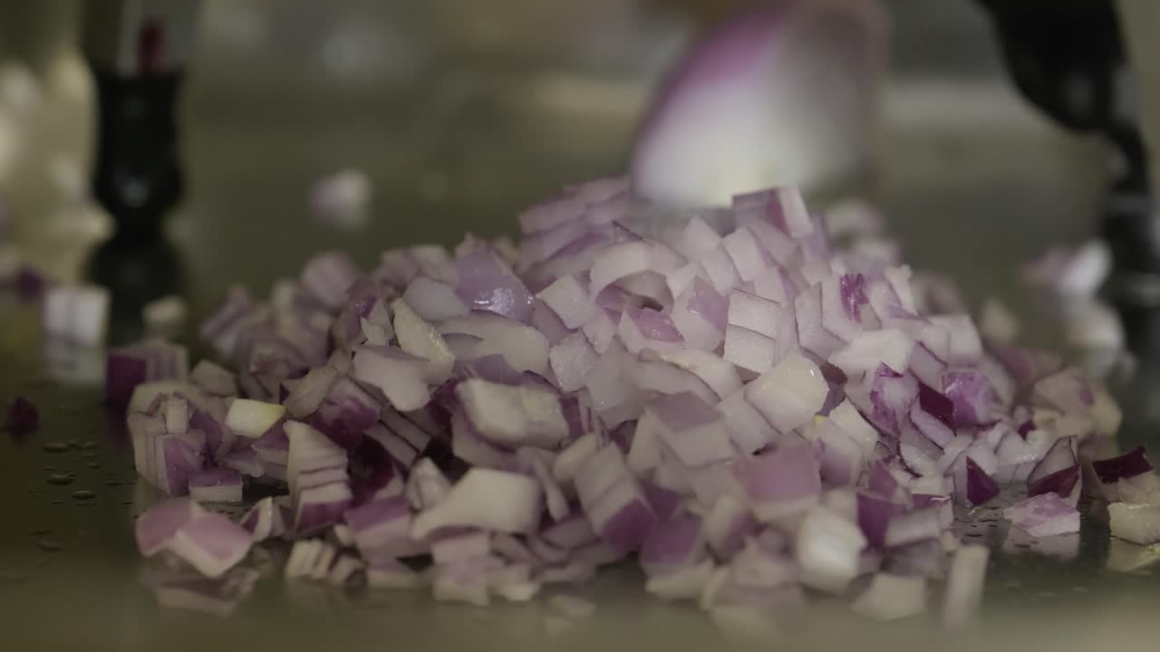 Chopping red onion. Mass production