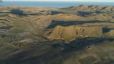 aerial view of mountainous landscape with vineyards and coastal scenery