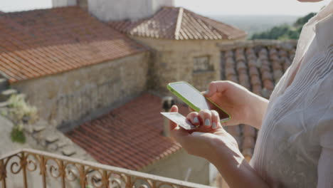 young woman using smartphone shopping online banking spending money on vacation enjoying holiday travel close up