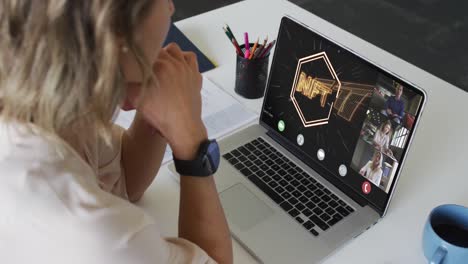 Caucasian-businesswoman-using-laptop-for-video-call-with-diverse-business-colleagues