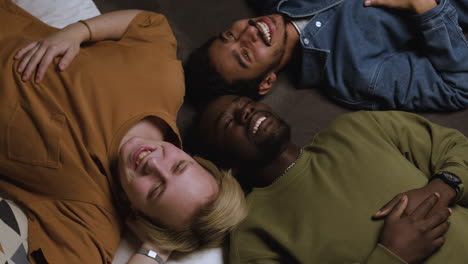 group of men laying on the bed