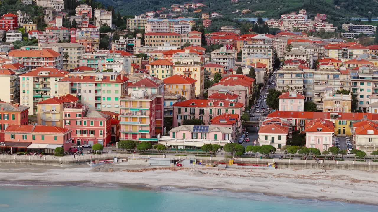 Colorful seaside town with red rooftops along the Italian coast, peaceful beach mood