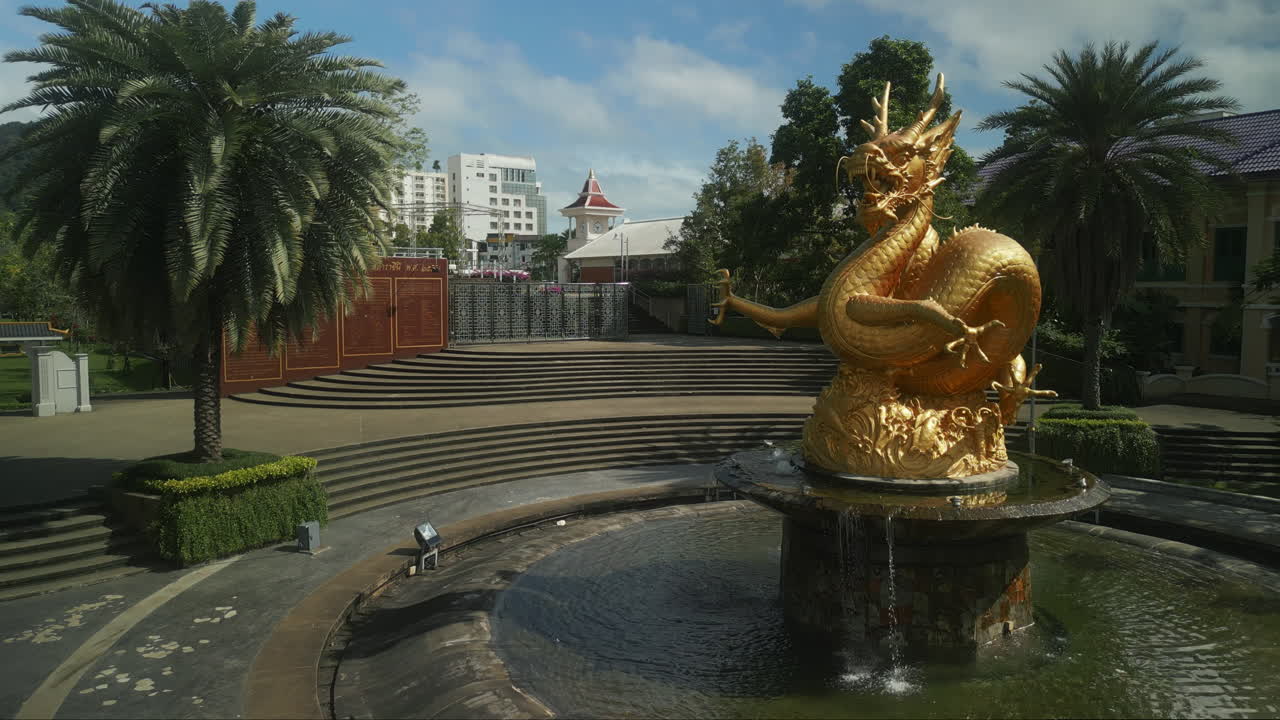 Golden Dragon Fountain in a Thai Temple Garden