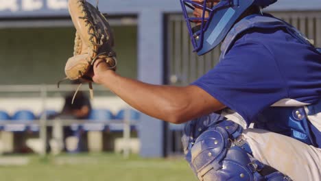 baseball player catching a ball during a match