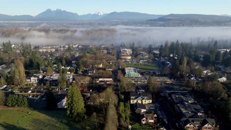 fort langley on a foggy morning in british columbia, canada. - aerial shot