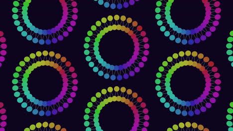 vibrant circles arranged in a circular motif on a black backdrop create a visually captivating and dynamic pattern in this intriguing image
