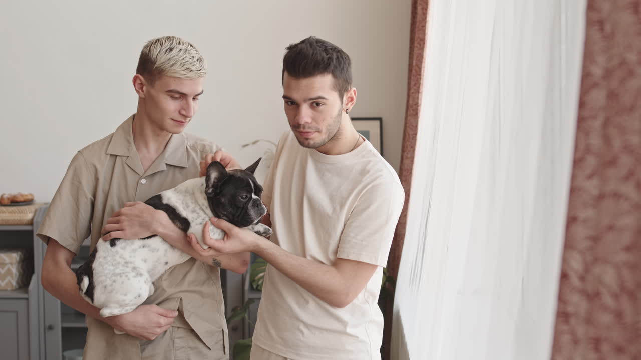 Portrait of Two Gay Men Petting Cute Dog