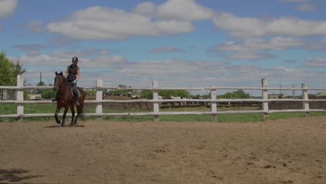 woman horseback riding on a farm