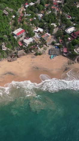 Aerial-perspective-captures-Mazunte-Beach-in-Oaxaca,-Mexico,-from-a-vertical-angle