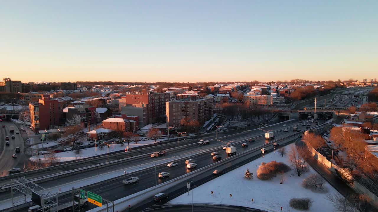 Drone Pan Shot of a Busy Highway With Cars Moving in Both Directions After a Snowy Winter Day