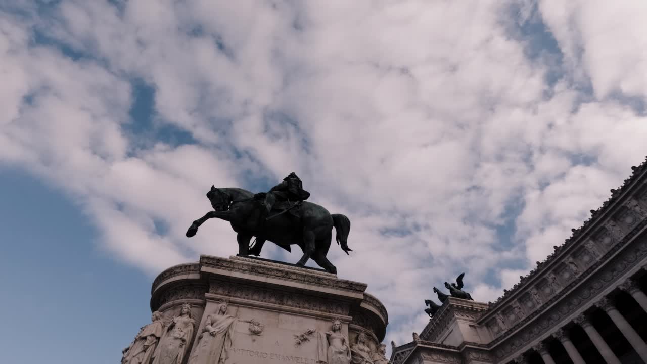 Majestic equestrian statue stands against a backdrop of dramatic clouds in a historical Rome square