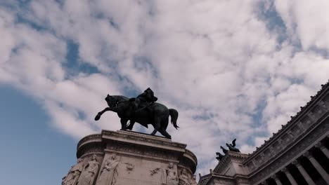majestic equestrian statue stands against a backdrop of dramatic clouds in a historical rome square