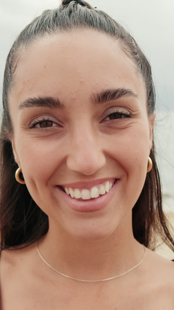 Young Woman Smiles at Beach