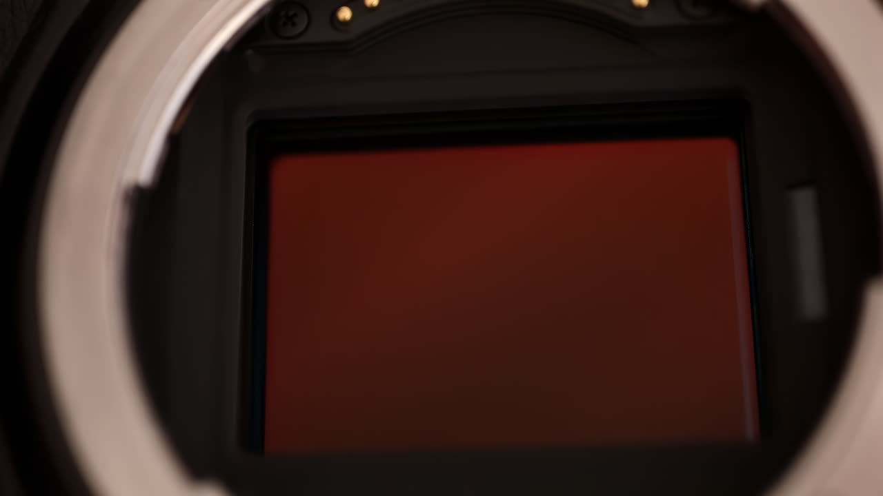 Close up view of a digital camera shutter opening