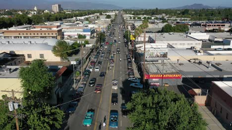 cars cruise down street