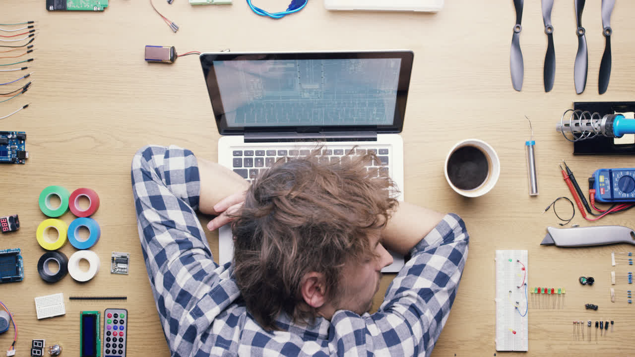 Top view technician hands working at desk from above - Red Epic Dragon